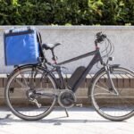 Image of an electric bicycle for deliveries parked outdoors.