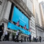 PowerSchool signage during the company's initial public offering, in front of the New York Stock Exchange.