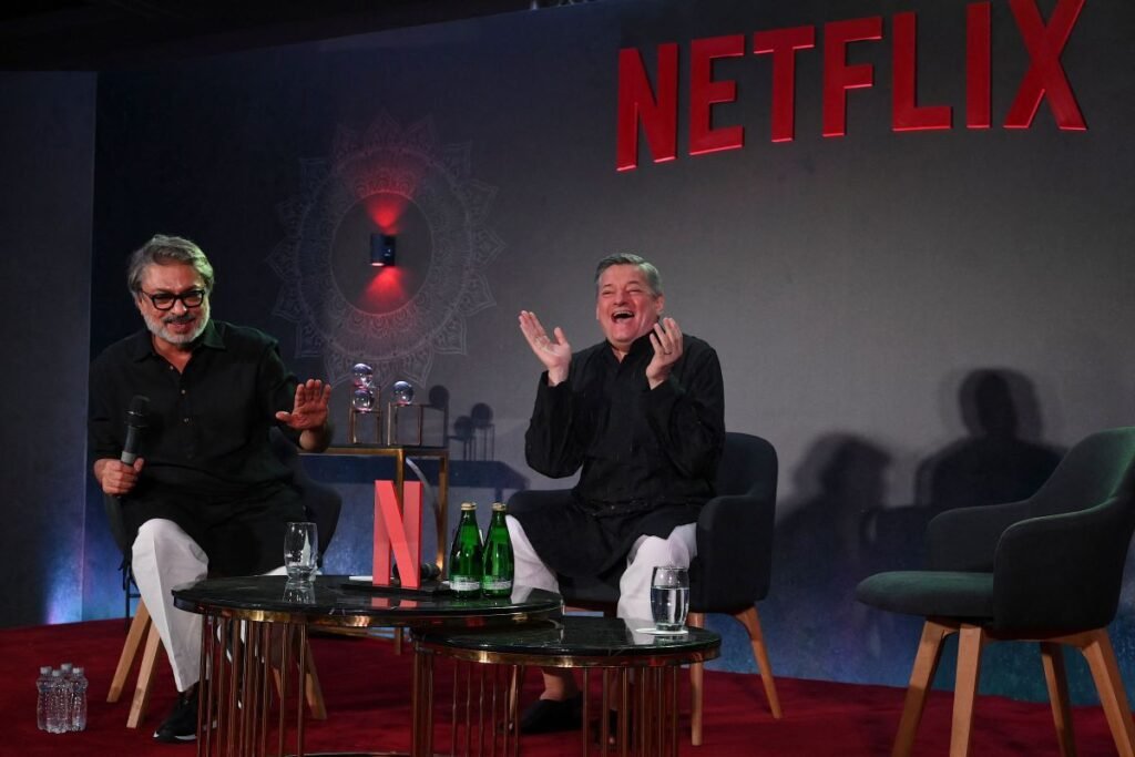 Bollywood director, screenwriter and music composer Sanjay Leela Bhansali (L) along with American businessman and co-chief executive officer of Netflix, Ted Sarandos.