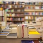 Interior of a modern bookstore with variety of books stacked all around.