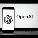the logos of Open AI displayed on both computer and smart phone screen