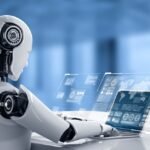 Robot humanoid uses laptop