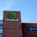 Looking up at Nvidia's headquarters with the sky behind it.