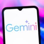 The Google Gemini AI logo is seen displayed on a smartphone screen.