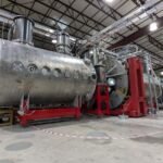 Realta Fusion's device sits in a large warehouse-like building.