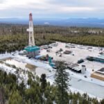 A geothermal drilling rig sits in a forest in Oregon.