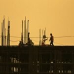 Men work at under construction site in New Delhi