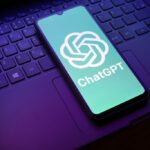The ChatGPT logo appears on a smartphone screen