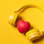 Yellow Headphones On Yellow Background And A Heart