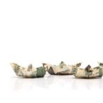 row of paper ships from dollar banknotes