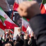 Iranian men shout anti-U.S. and anti-Israeli slogans in front of a portrait of Iran's new Supreme Leader, Ayatollah Mojtaba Khamenei, the son of the late Leader Ayatollah Ali Khamenei, during a rally to pledge allegiance to Mojtaba Khamenei amid the U.S.-Israeli military campaign in Tehran, Iran, on March 9, 2026.