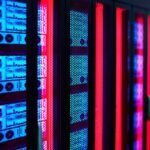 Servers glow in a data center rack.