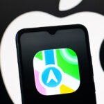 In this photo illustration, the Apple Maps logo is seen displayed on a smartphone screen.