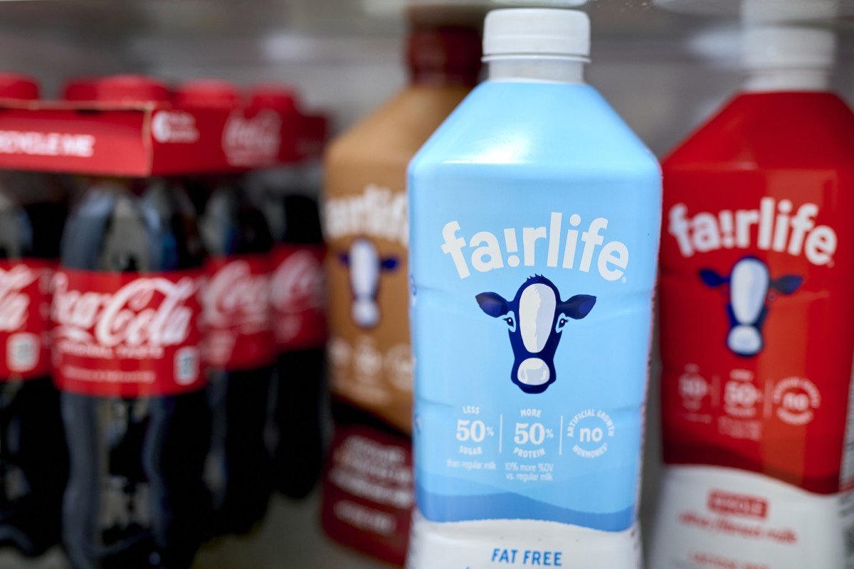 Fairlife ultra-filtered fat free, whole, and chocolate milk and Coca-Cola bottles arranged in Germantown, New York, US, on Tuesday, Dec. 3, 2024. Fairlife, which uses a specialized filtering process to boost protein and cut sugar and lactose in its milk products, helped spark the modern protein craze that's unfolded alongside the rise of Ozempic and other GLP-1 drugs. Photographer: Gabby Jones/Bloomberg via Getty Images